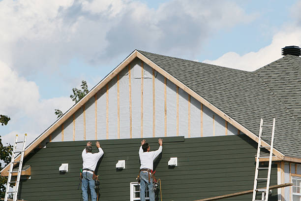 Professional Storm Damage Siding Repair technician working in Swanton, OH